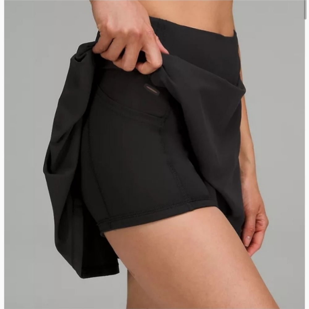 All black Lululemon Pace Rival mid-rise tennis skirt size 4